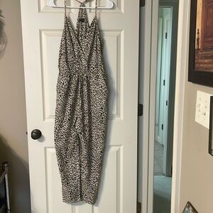 - Storia women’s size small cheetah print jumpsuit
